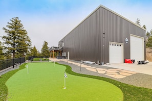 House Exterior | Putting Green | Private Hot Tub | Private Yard w/ Cornhole