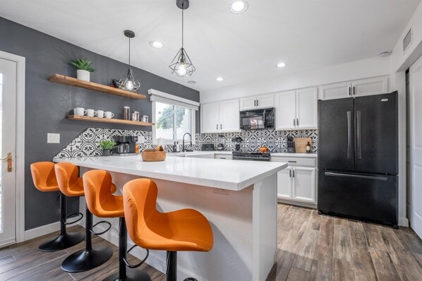Our kitchen's got you covered with ample space to prep - with massive fridge