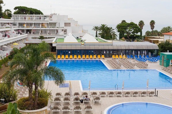 Outdoor swimming pool and sun loungers