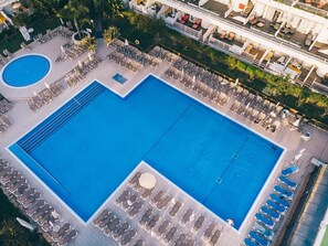 Outdoor swimming pool and sun loungers