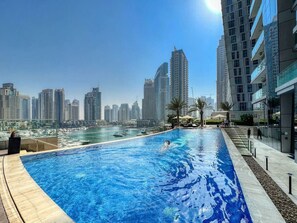 Rooftop Pool Oasis: Dive into luxury with stunning skyline views and refreshing azure waters!