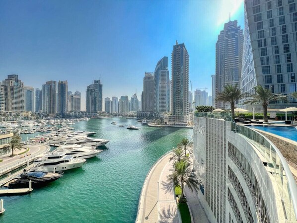 Stunning Marina Views: Bask in breathtaking skyline and yacht vistas from your private balcony!