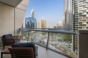 Balcony Oasis: Unwind with stunning city views and chic seating under the Dubai skyline!