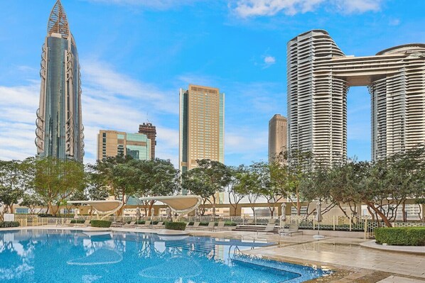Poolside Oasis: Dive into luxury with stunning skyline views and refreshing azure waters!