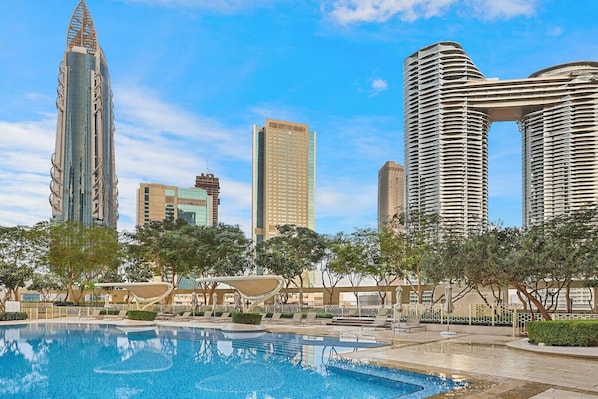 Poolside Oasis: Dive into luxury with stunning skyline views and refreshing azure waters!