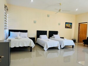 Bedroom with double bed and two twin beds