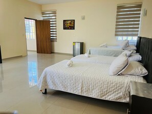Bedroom with double bed and two twin beds