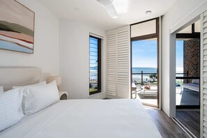 Enjoy sea views from the comfort of bed.