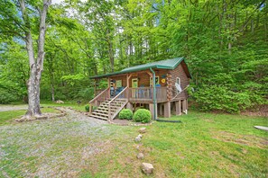 Cozy wood cabin tucked into the forest, offering serene privacy and a true nature escape.