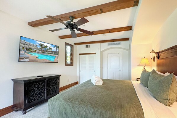 Lounge beneath the gentle breeze of the ceiling fan as you cozy up in the embrace of a king-sized bed, or catch your favorite shows on the large TV.