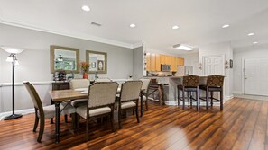 The dining room table seats six comfortably, along with kitchen bar seating 