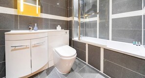 TILED BATHROOM AND BATHTUB