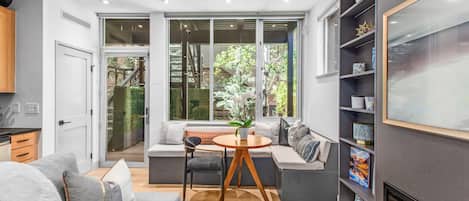 Light-filled kitchen/living/dining area. NOTE: the couch bed pulls out into a comfortable full-sized bed.
