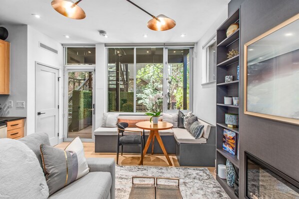 Light-filled kitchen/living/dining area. NOTE: the couch bed pulls out into a comfortable full-sized bed.