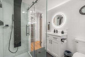 Bathroom, Shower with waterfall, rainfall, and body jets. Mirror with antifog