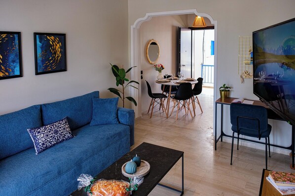 Living room, desk and dining area