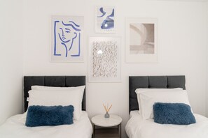 Bedroom 1 has a Smart TV and a comfortable zip-link bed which is configured as two single beds by default or can be zipped together to form a king size bed upon request.