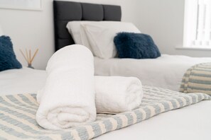 Bedroom 1 has a Smart TV and a comfortable zip-link bed which is configured as two single beds by default or can be zipped together to form a king size bed upon request.