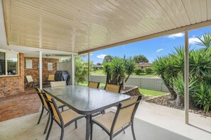 Dine alfresco out on the covered patio. It comes with a BBQ to whip up a feast.
