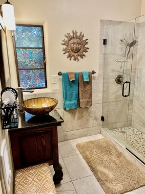 Relax and rejuvenate in this beautifully remodeled bathroom.