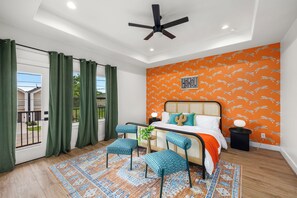 Master's bedroom with king bed and ceiling fan