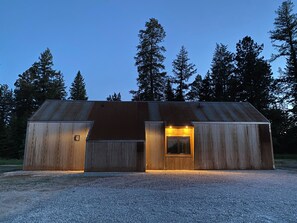 The front side of the cabin, with the kitchen window looking toward the driveway