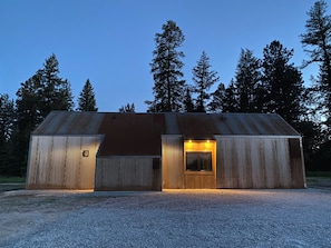 The front side of the cabin, with the kitchen window looking toward the driveway