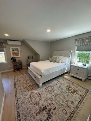 Upstairs bedroom with queen sized mattress