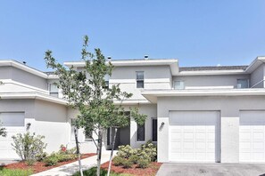 Private townhouse entrance with garage