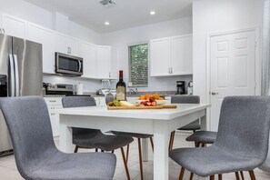 Open plan living area and well equipped kitchen, with toaster, coffee maker, Keurig, coffee grinder, and all the major appliances.