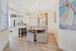 Open plan kitchen,  with breakfast bar and dining area.