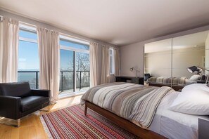 Unwind and admire the views from this tranquil bedroom suite.
.