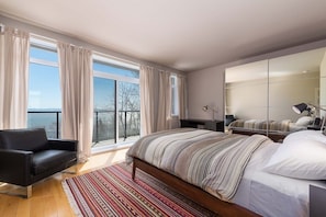 Unwind and admire the views from this tranquil bedroom suite.
.