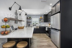 This kitchen has all you will need for your vacation needs...all the major appliances, a huge double refrigerator with ice maker, wine cooler, coffee station, and much more...