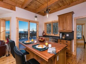 Enjoy meals with a view in this bright kitchen space.