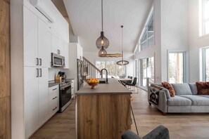 Open kitchen and living space perfect for gathering.