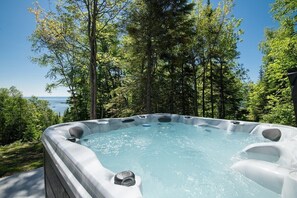 Relax in the bubbly spa surrounded by nature.