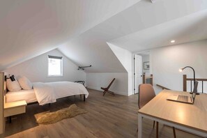 Bright loft bedroom retreat, perfect for peaceful rest.