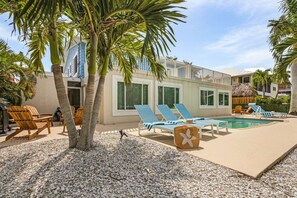 A pool, sun loungers and seating for everyone