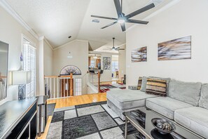 Living room with door to the beautiful deck on the left.