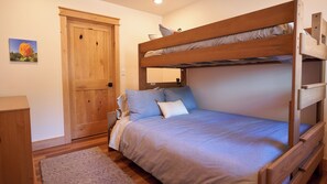 2nd bedroom with twin xl-over-queen bunk bed and walk in closet.