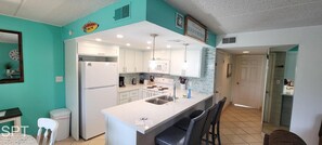 Indoors, Kitchen, Refrigerator, Dining Table, Furniture