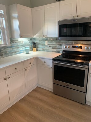 Kitchen with all new stainless steel appliances and quartz countertops