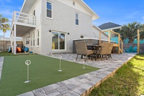 Swim Spa and Putting Green with clubs for fun!