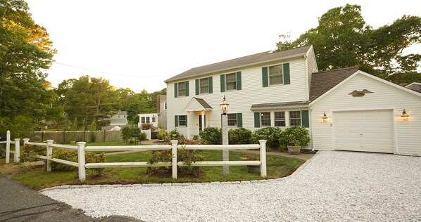 Beautiful lawn wrapping around the house, perfect for little ones to run around. Parking in gravel driveway for 3 vehicles.