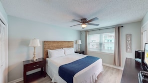 The king suite boasts a comfy, voluminous king size bed, a ceiling fan, and soft lighting so you can enjoy a restful night's sleep after a long day in the sun.