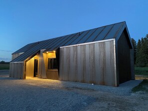 The front side of the cabin, with the kitchen window looking toward the driveway