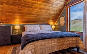 Loft bedroom with King bed and attached bathroom.