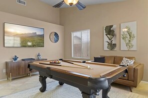 Enjoy your favorite TV show or play a game of pool!