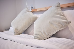 High-quality linens, sheets, and enough pillows to start a small pillow war.